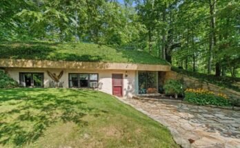 An earth-sheltered home in Ohio has a roof that needs mowing