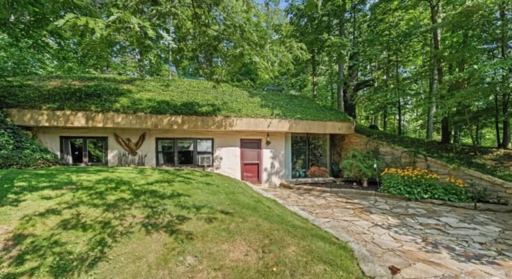 An earth-sheltered home in Ohio has a roof that needs mowing